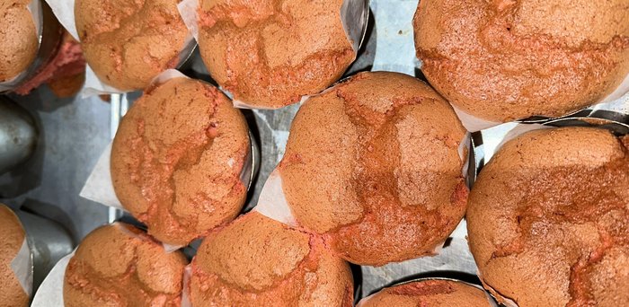 Red Velvet spongie cakes, sliced open showing reddish crumb